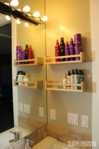 Mount a few spice racks to the wall to store your hair products and lotions
