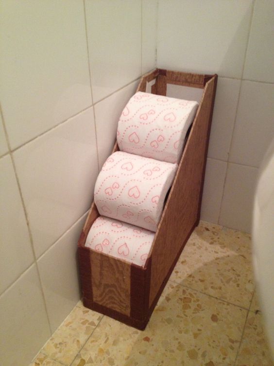 Repurpose a magazine rack to hold toilet paper rolls