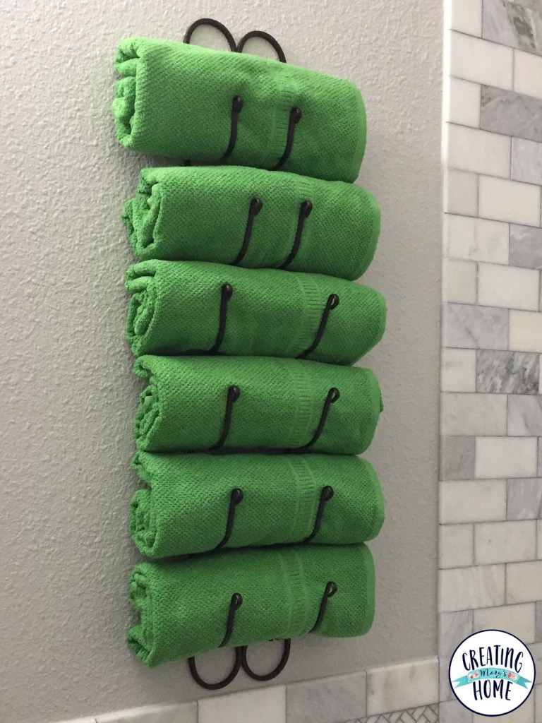 Repurpose a wine rack as a towel holder