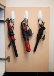Use Command Hooks Inside Bathroom Cabinet For Storing Hair Tools