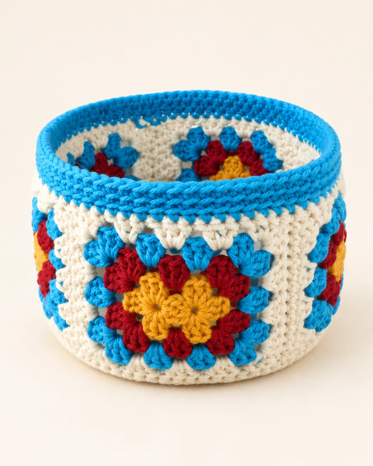 Granny Square Basket, finished product on a warm off-white background