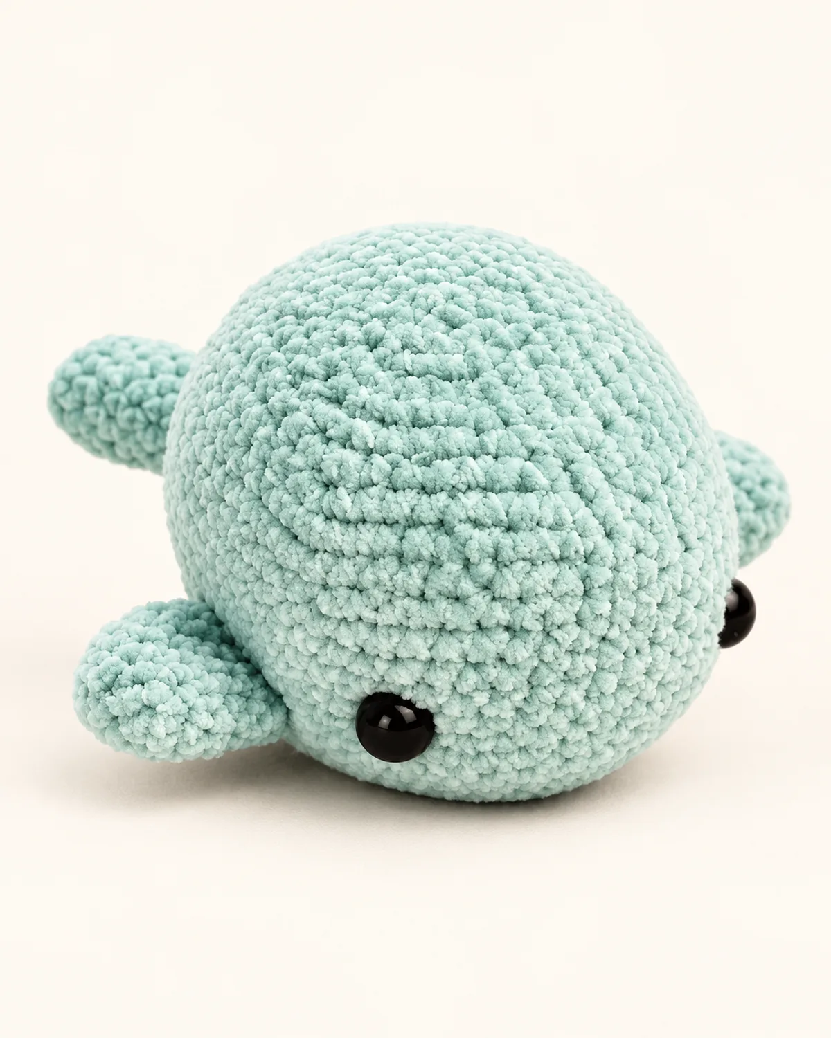Lulu Whale Plush, finished product on a warm off-white background
