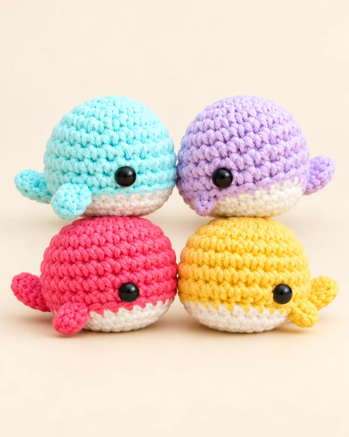 Mini Whale Amigurumi Set, finished product on a warm off-white background