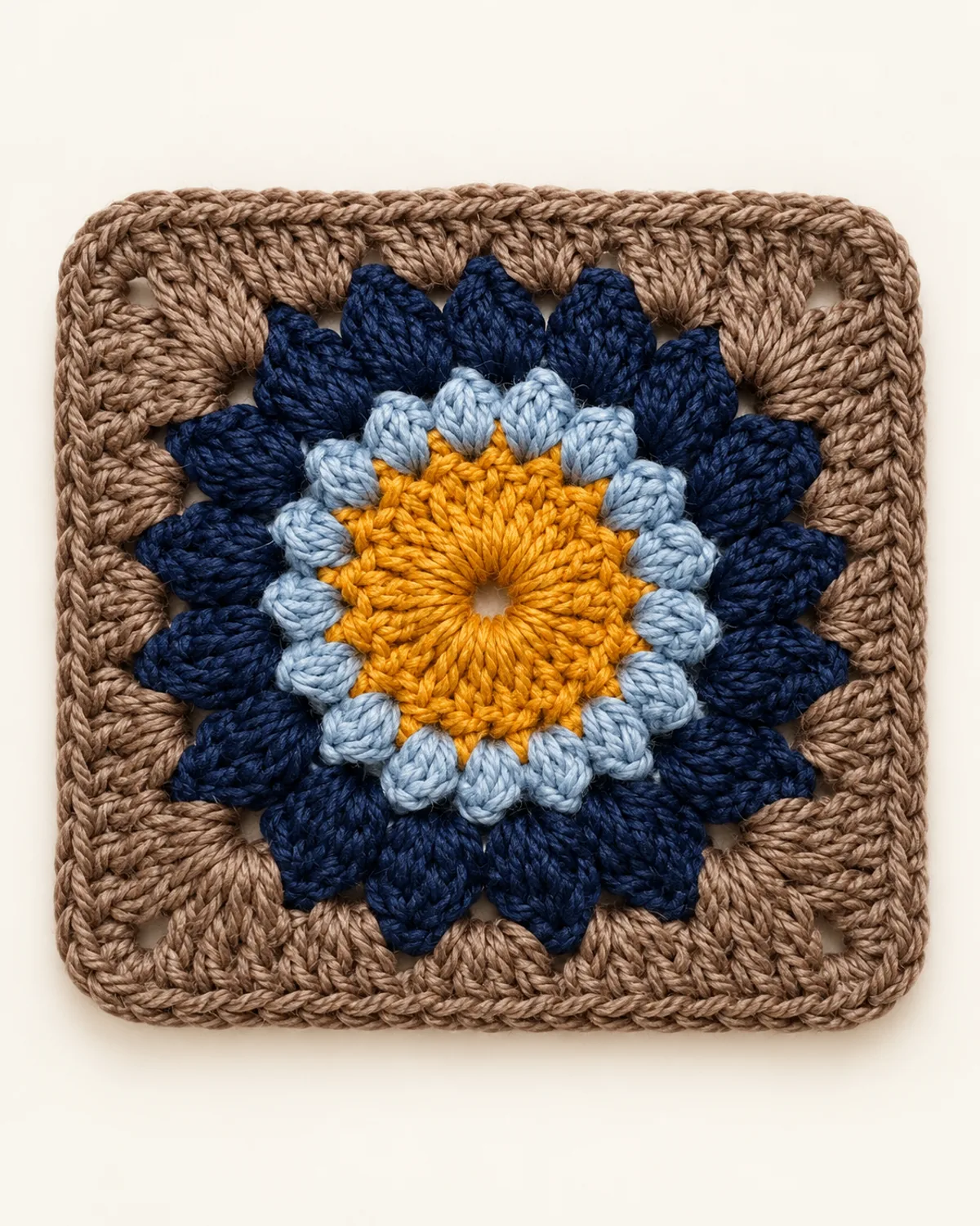 Puff Stitch Flower Granny Square, finished product on a warm off-white background