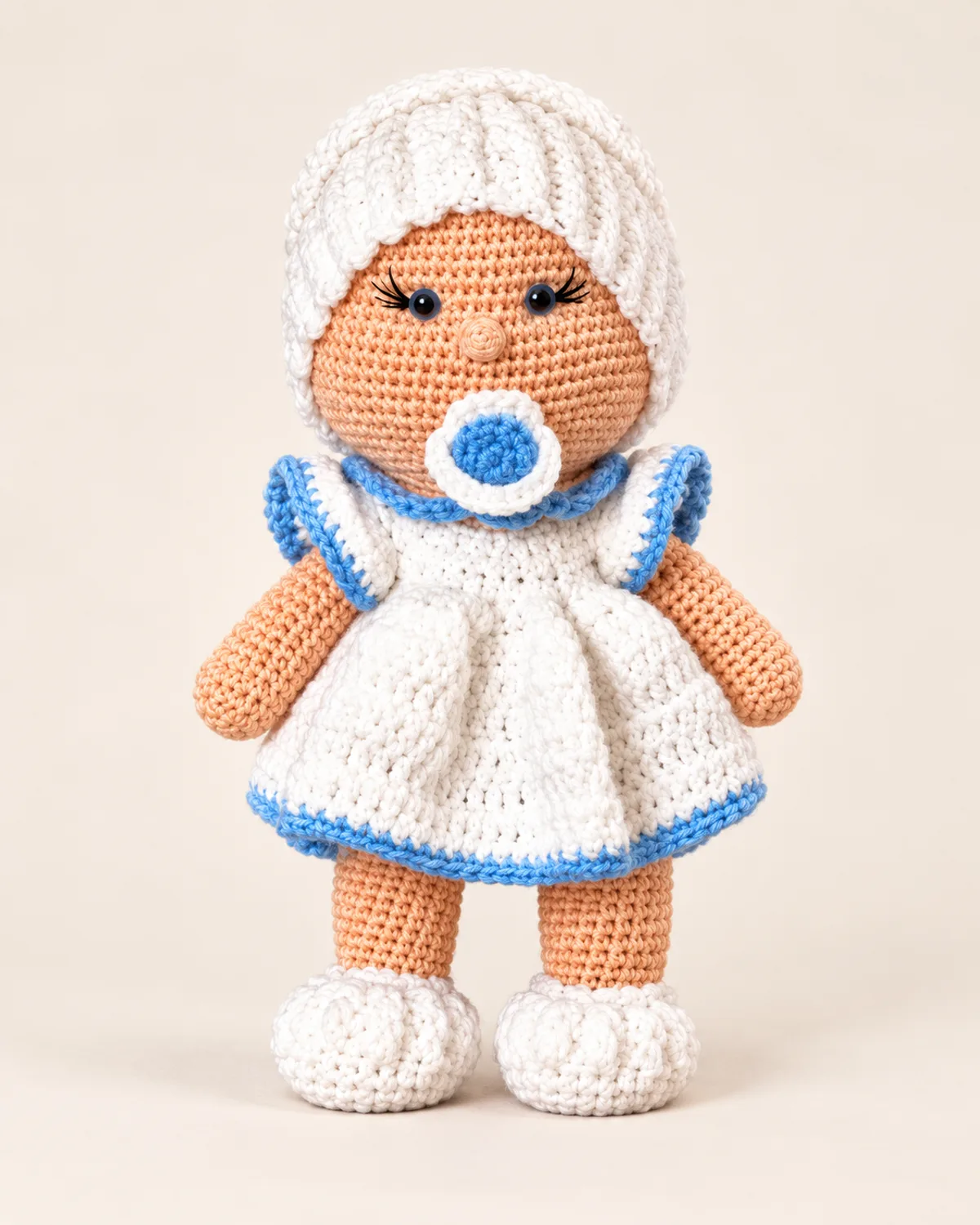 Baby Doll with Bonnet, finished product on a warm off-white background