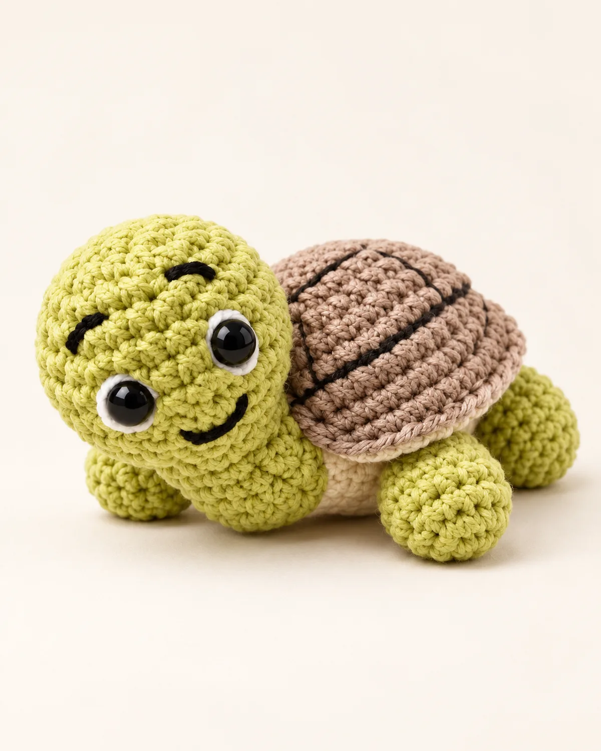 Amigurumi Turtle, finished product on a warm off-white background