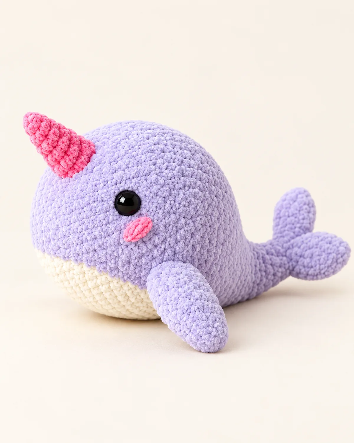 Plush Narwhal, finished product on a warm off-white background