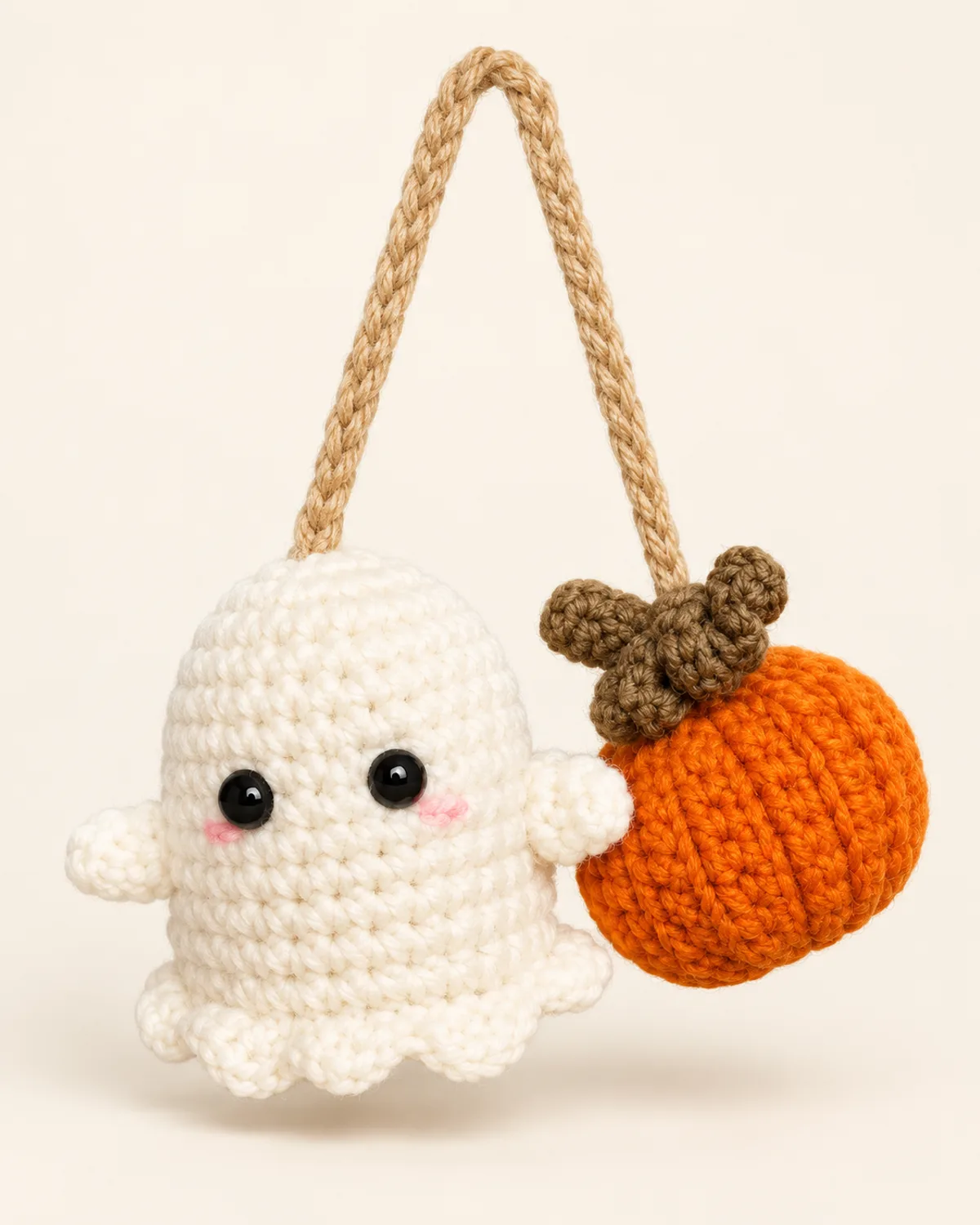 Ghost and Pumpkin Hanging Decoration, finished product on a warm off-white background