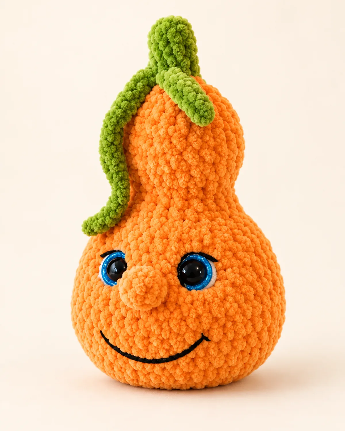 Stacked Pumpkin Plush, finished product on a warm off-white background