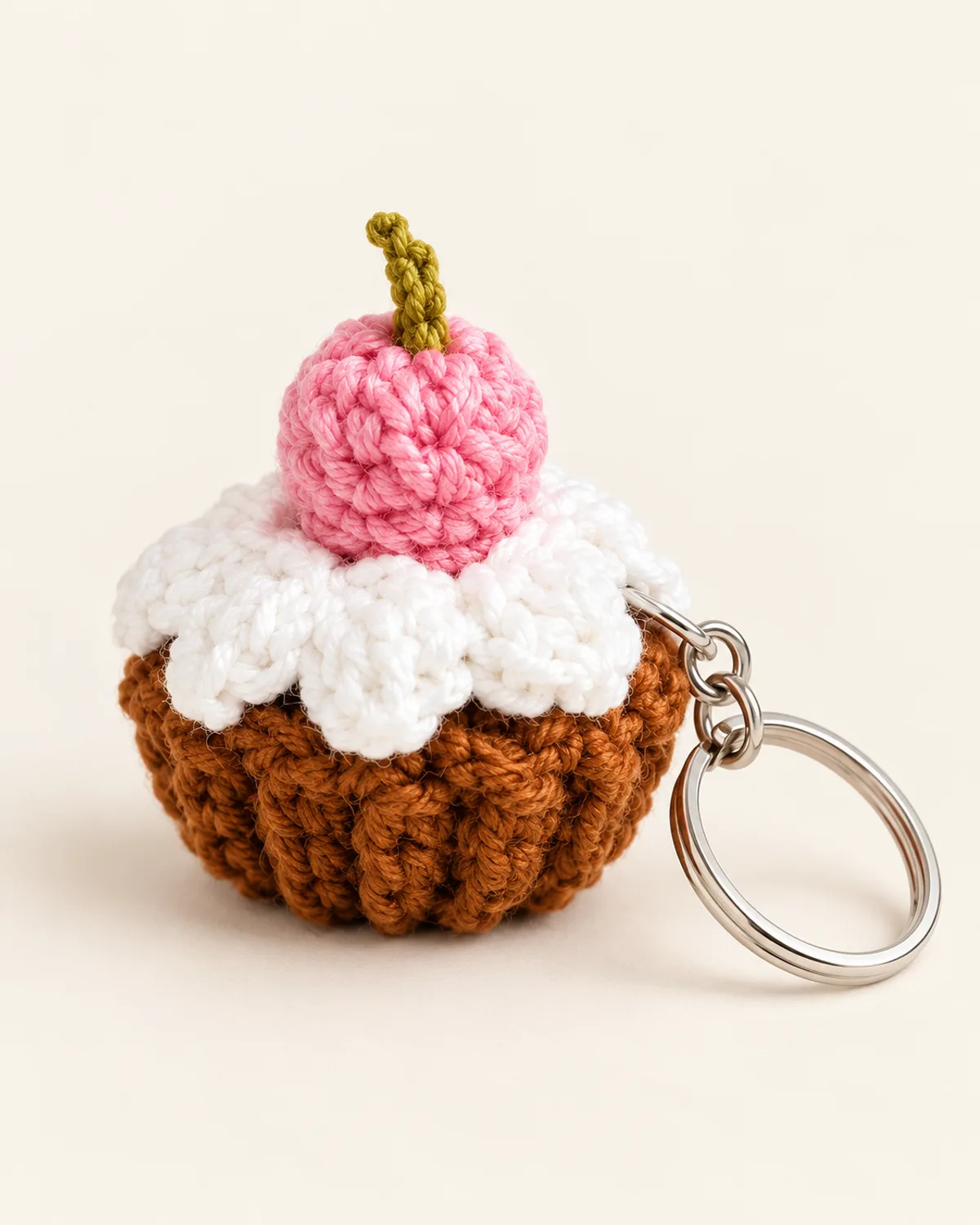 Mini Cupcake Keychain, finished product on a warm off-white background