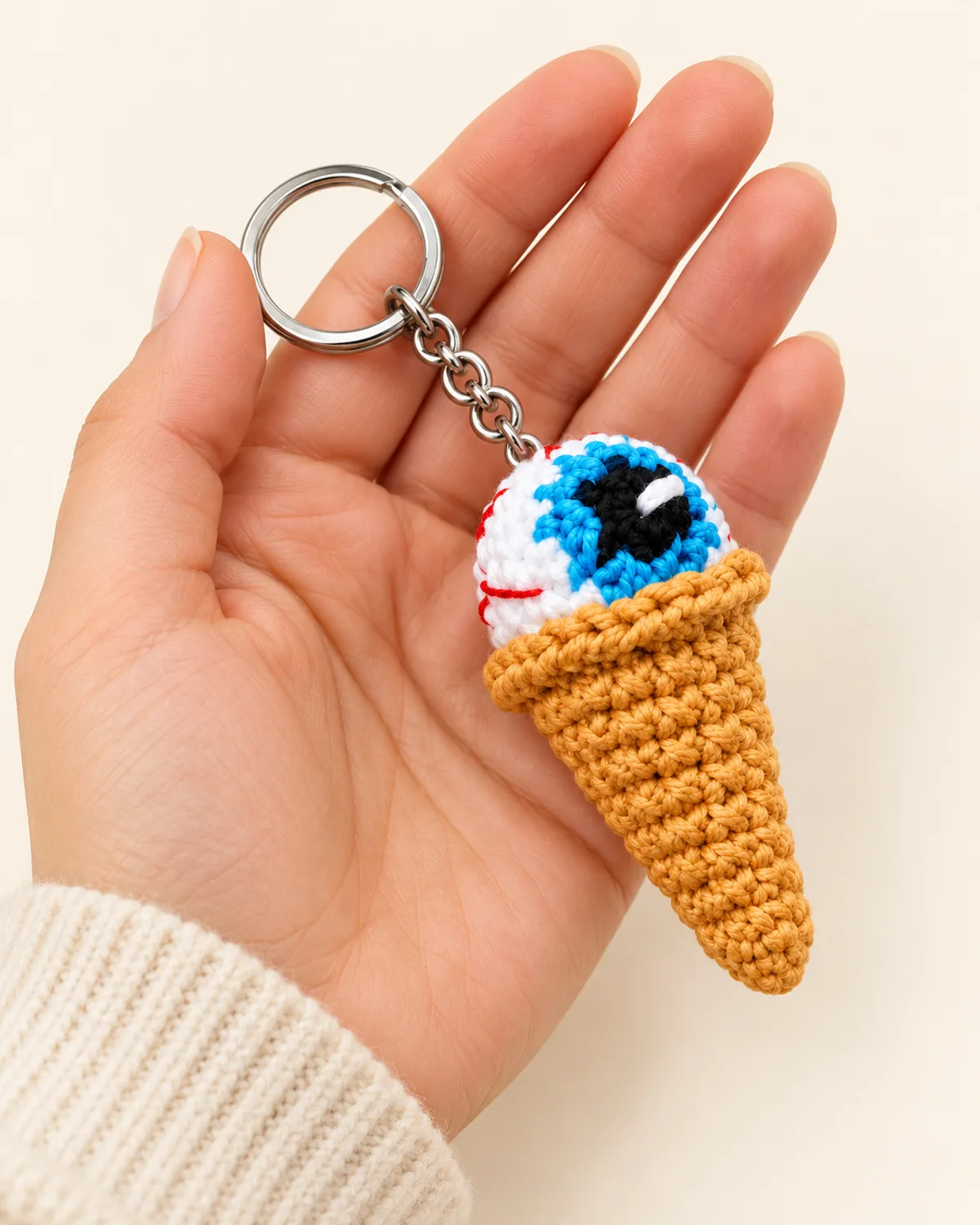 Eyeball Ice Cream Cone Keychain, side three-quarter view in use