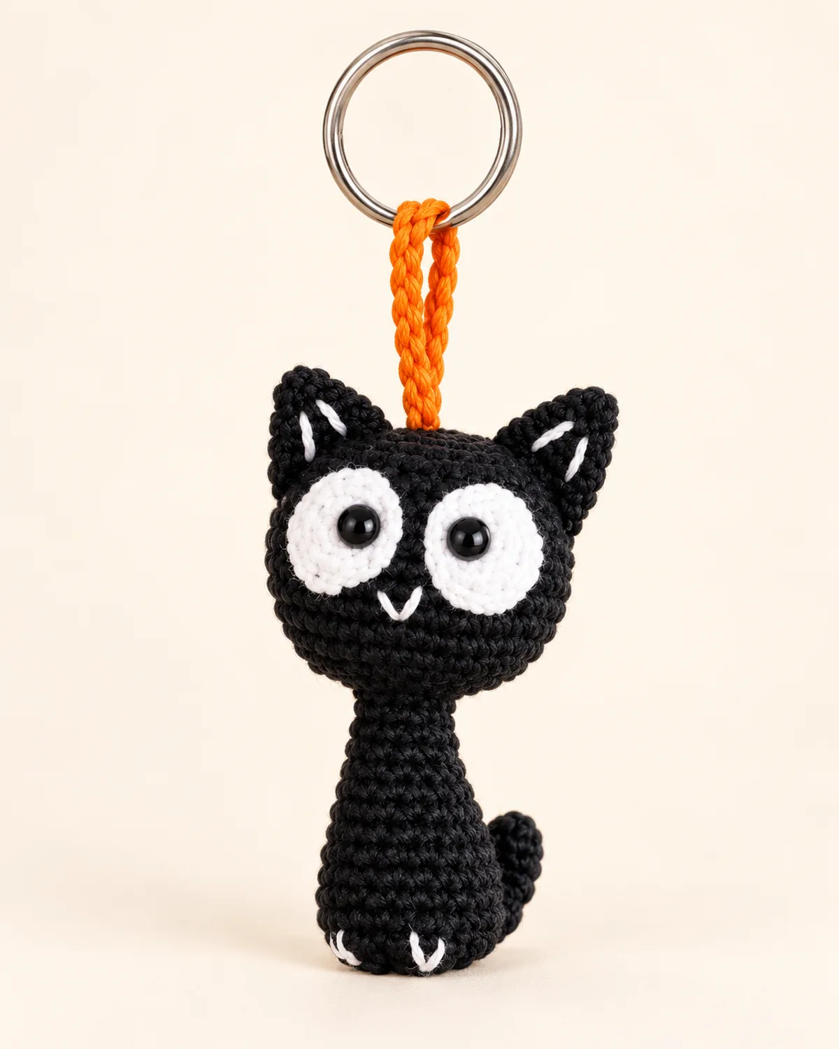 Cat Keychain, finished product on a warm off-white background