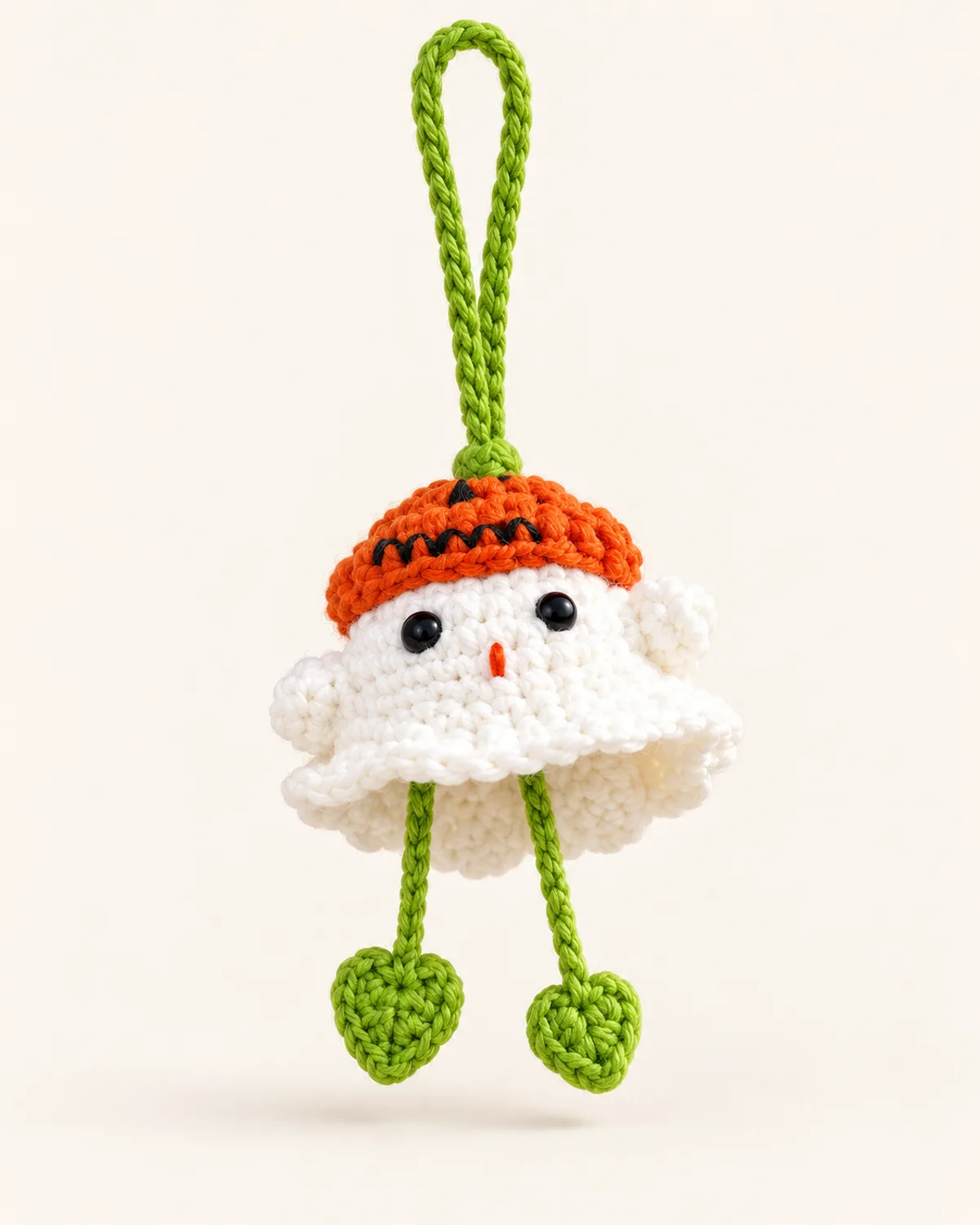 Ghost and Pumpkin Keychain, finished product on a warm off-white background