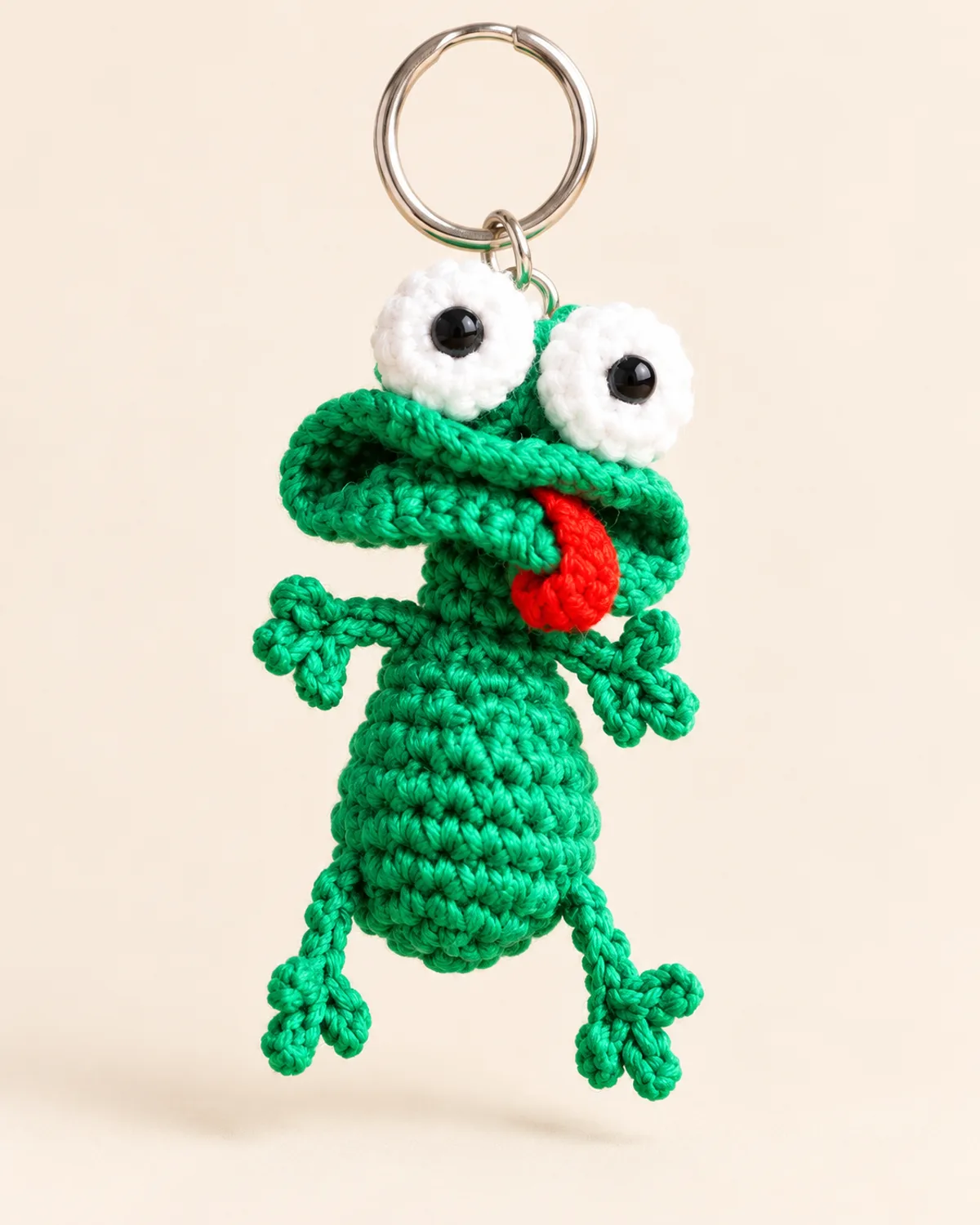 Frog Keychain, finished product on a warm off-white background