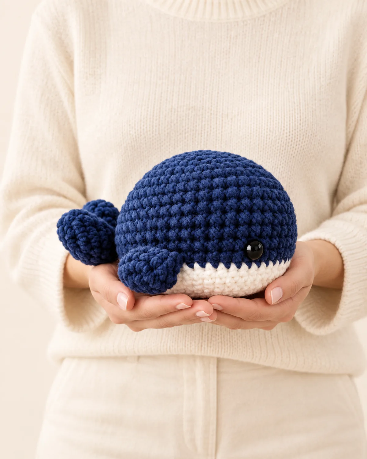 Navy Blue Whale Amigurumi, front three-quarter view in use