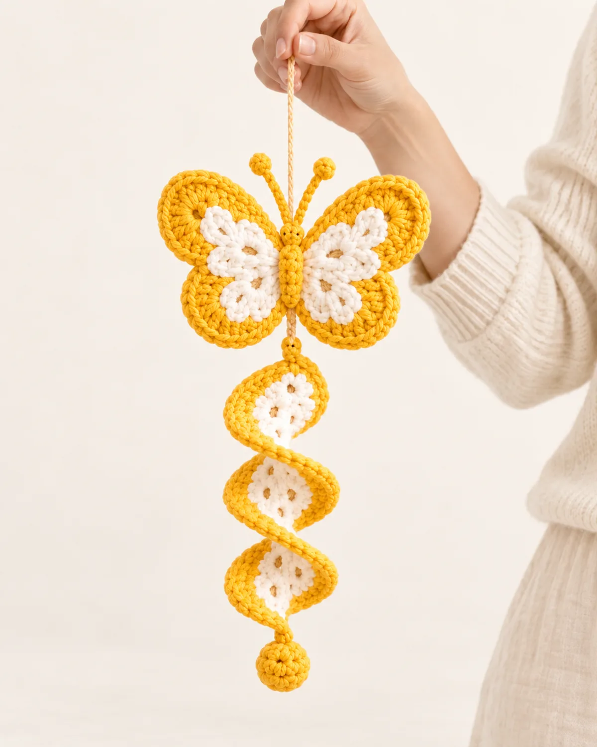 Butterfly Spiral Wind Spinner, front three-quarter view in use