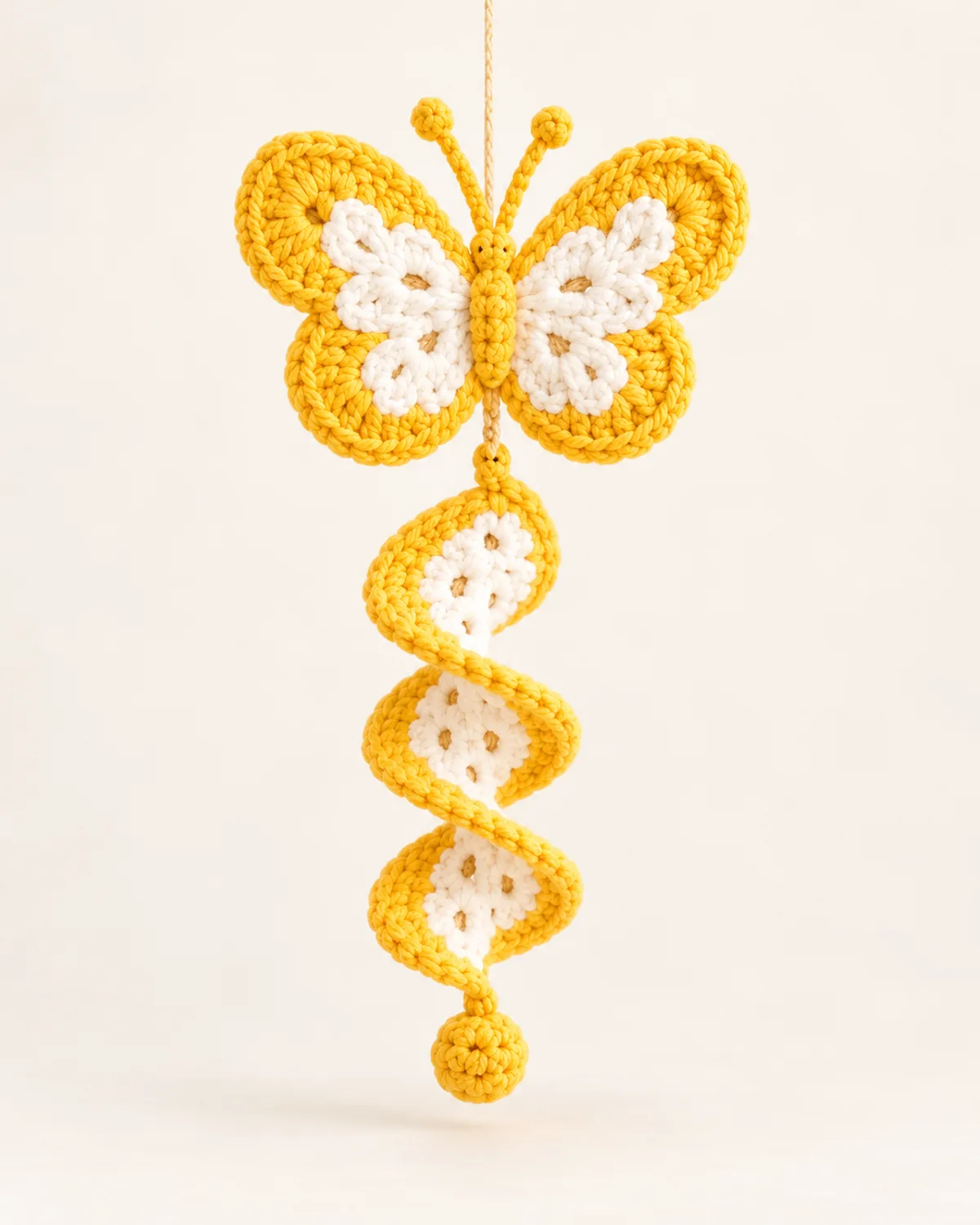 Butterfly Spiral Wind Spinner, finished product on a warm off-white background