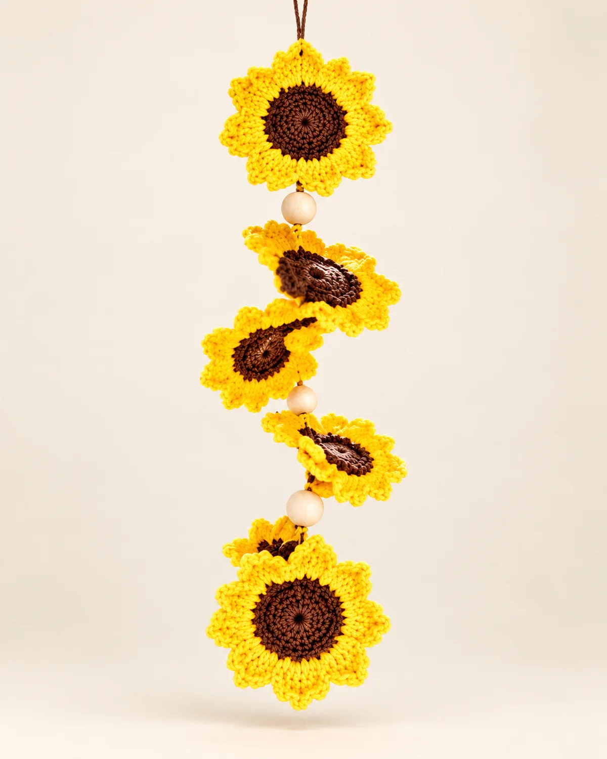 Sunflower Spiral Wind Spinner, finished product on a warm off-white background