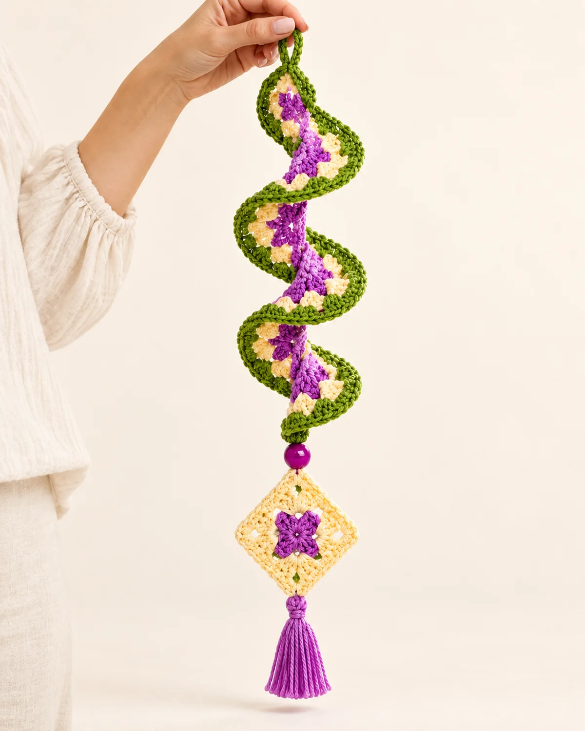 Bohemian Diamond Talisman Spiral Wind Spinner, front three-quarter view in use