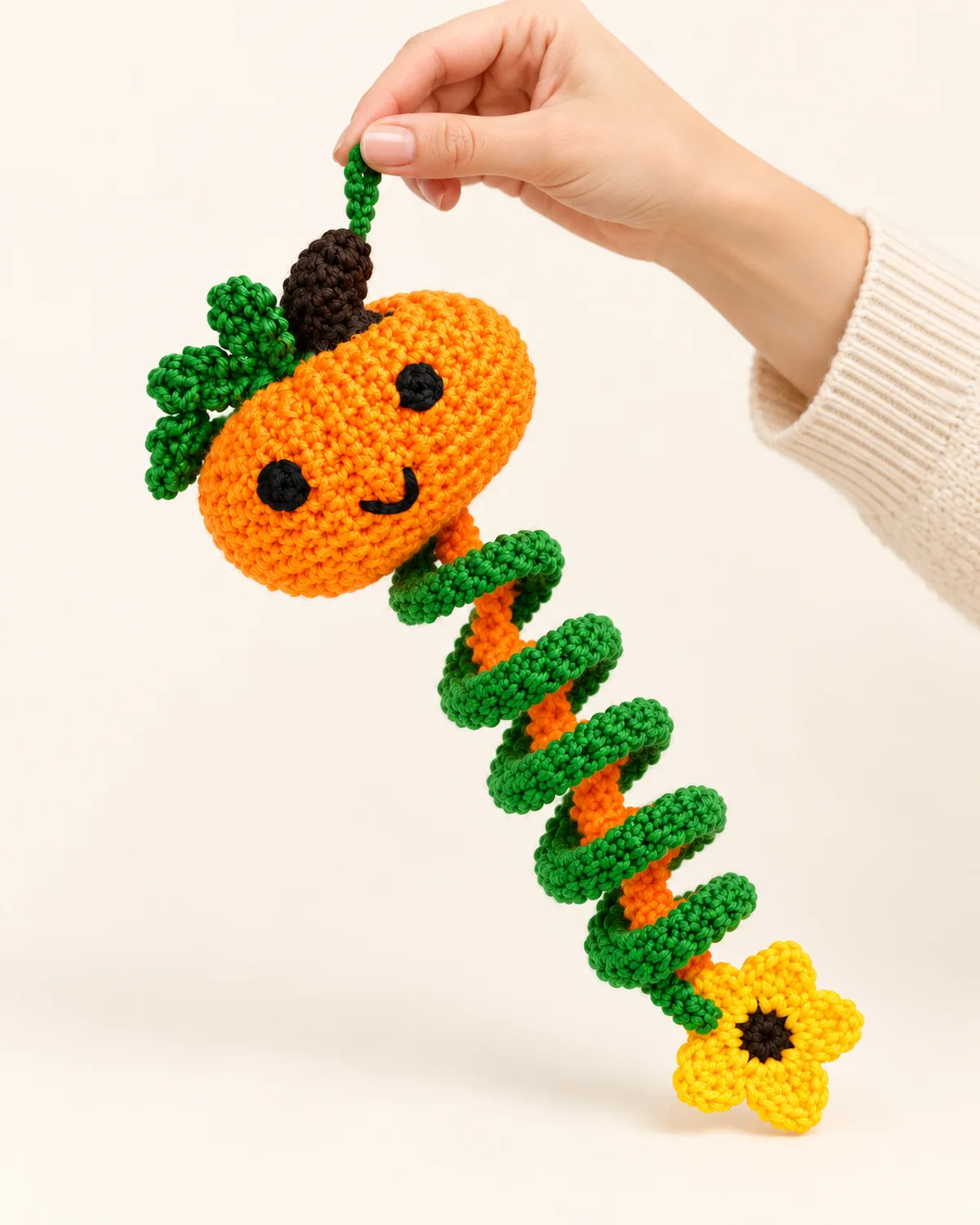 Pumpkin Spiral Wind Spinner, front three-quarter view in use