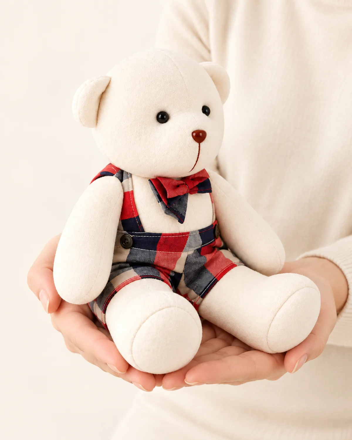 Keepsake Memory Bear in Overalls, side three-quarter view in use