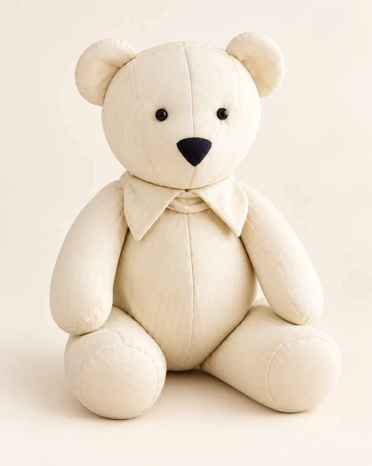 Classic Memory Bear, finished product on a warm off-white background